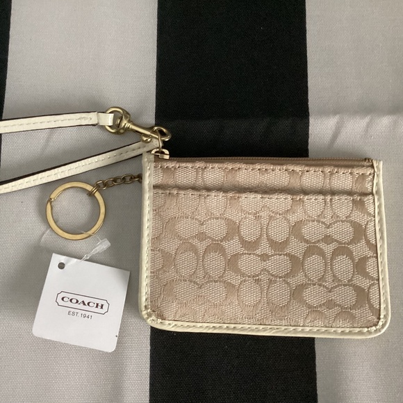 Coach Handbags - Coach Light Khaki/White Signature C ID Skinny NWT F45816
